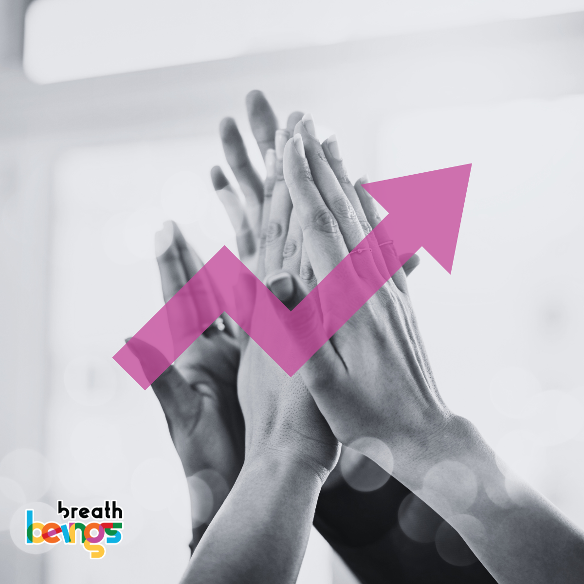 In this image there are hands that are touching each other with a symbolic arrow sign in the front to symbolise how inclusivity and growth are interdependent.