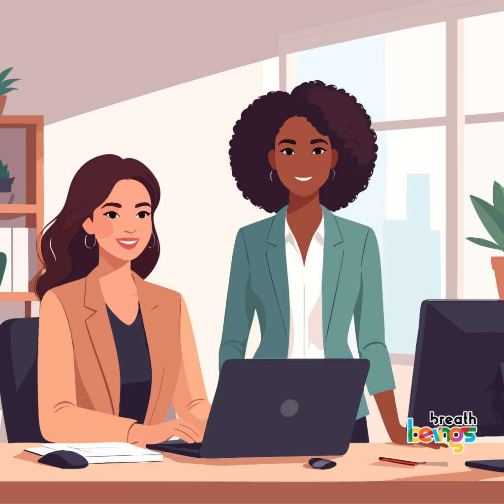 The image depicts two women in an office environment; one is seated at a desk, working on a laptop, while the other stands behind her, seemingly engaged in the work process. The seated woman has fair skin, long brown hair, and is wearing a tan blazer over a dark top, accessorized with hoop earrings. She is smiling slightly, conveying a pleasant and approachable demeanor. In front of her is a laptop, a notebook, and a mouse on a light brown desk. The standing woman has dark skin, curly dark hair, and is wearing a teal blazer over a white collared shirt. She also has hoop earrings and is smiling warmly, creating a welcoming and collaborative atmosphere. Behind her is a large window with a view of buildings, suggesting a city office. The office setting includes a shelf with plants and books, adding a touch of nature and organization to the space. There is also a black computer monitor next to the desk and a pencil on the desk